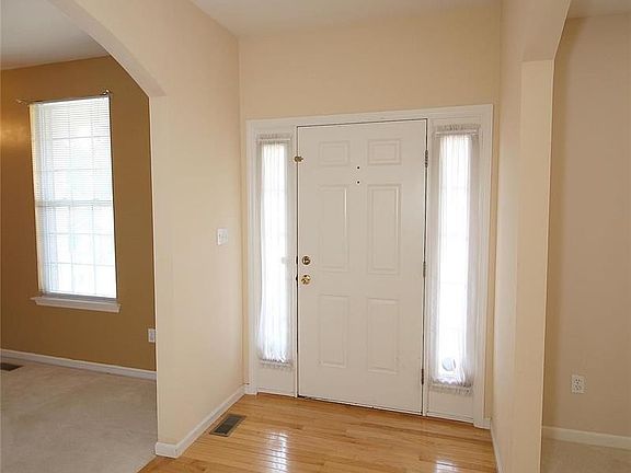 Foyer with beautiful wood flooring