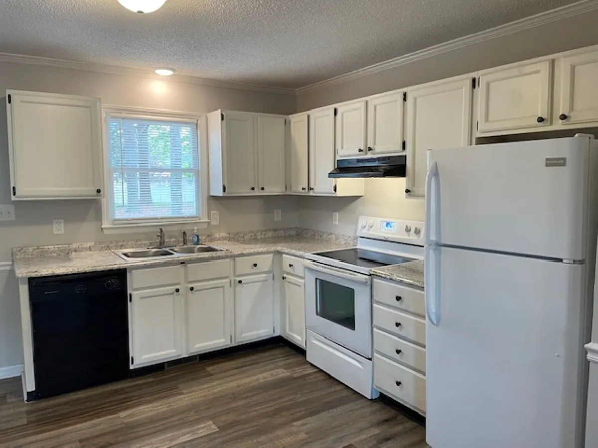 Kitchen with luxury vinyl plank flooring throughout - 211 W Judd St #211