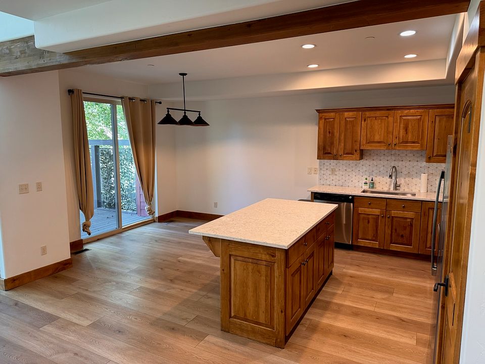 Kitchen and dining room area with sliding door to large back patio