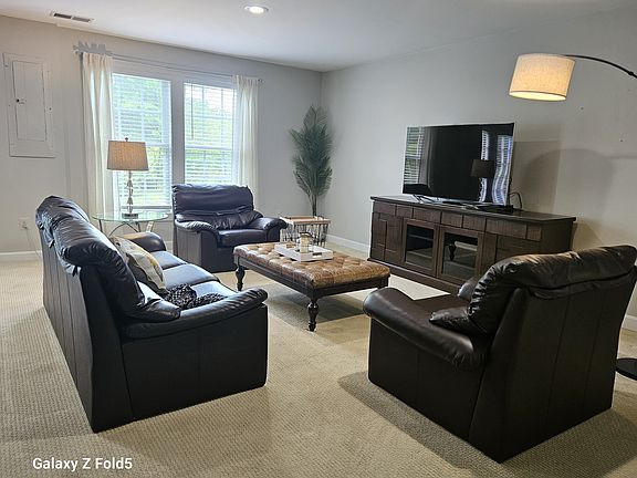 Massive family room to relax in with Roku TV to access your streaming platforms of choice.
