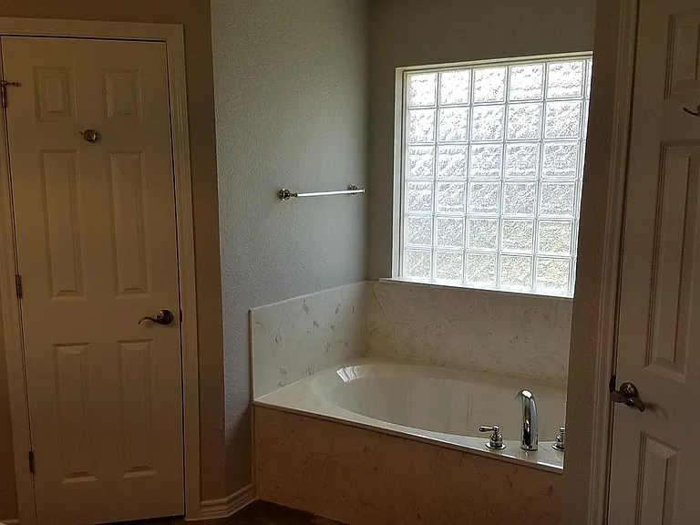 Master bath with garden tub, stand up shower, double vanity, double closet, separate toilet