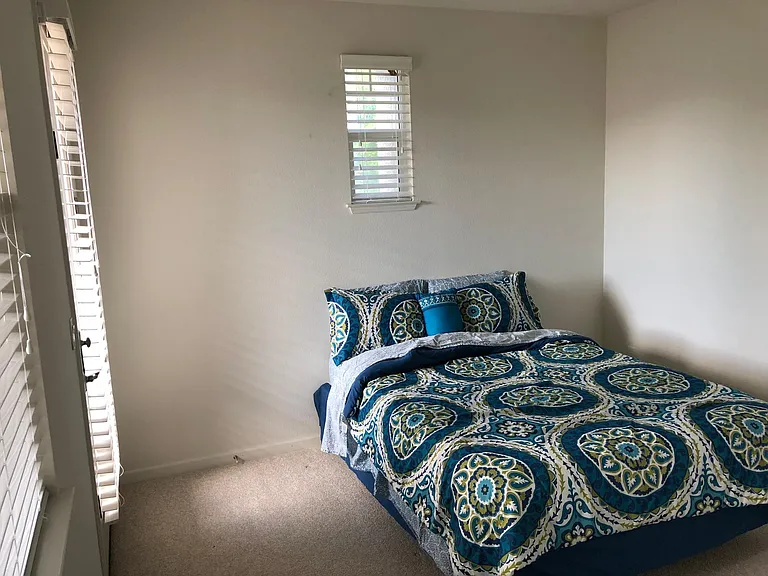 Guest bedroom upstairs with patio and attached bathroom