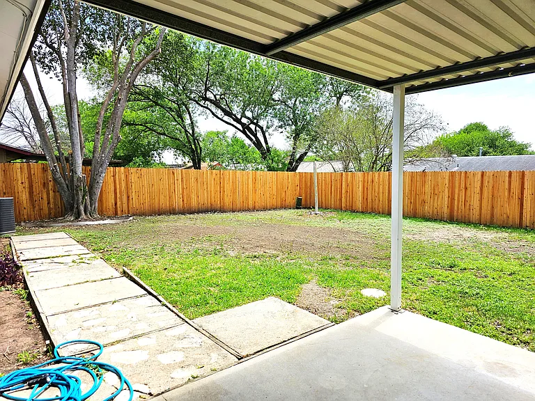 Backyard. One of a few in the neighborhood with a privacy fence.