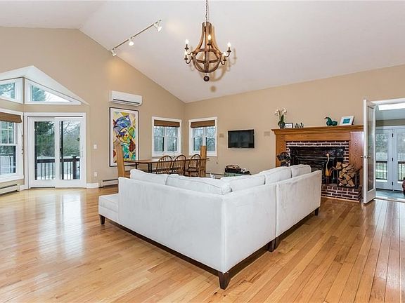 Living room with alcove and sun room beyond
