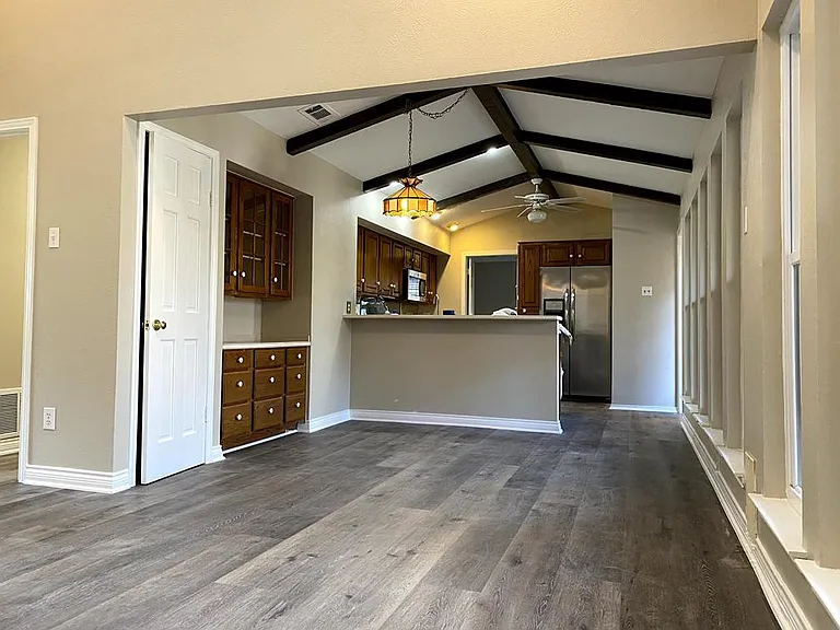 Family room view into breakfast area and kitchen