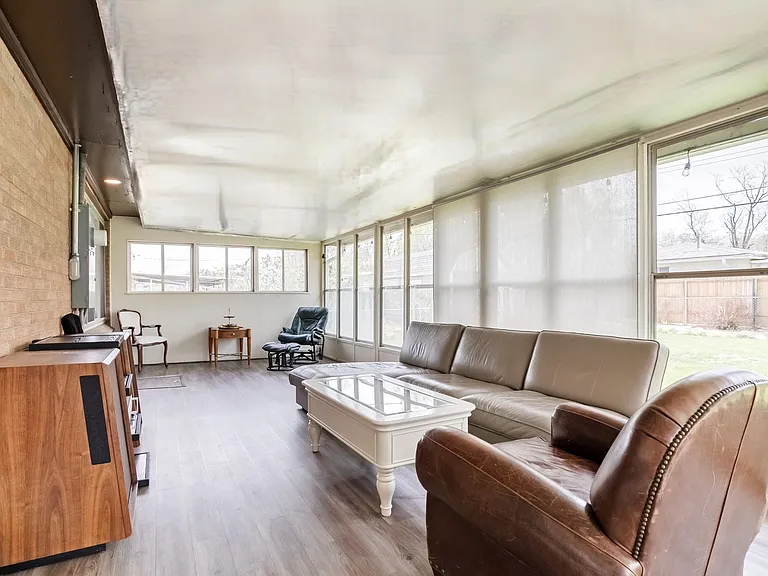Bonus sunroom with natural sunlight. Can be used as an office, play area, dining room or the perfect plant sanctuary.