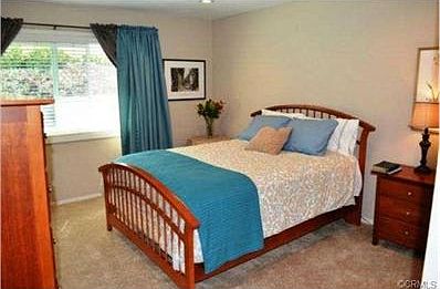 Master bedroom with sunlight from back yard