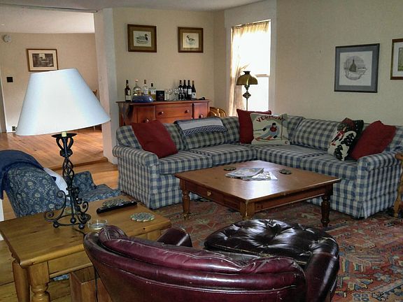 Livingroom looking into dining room. Couch is now a navy love seat with chaise as see in other photo