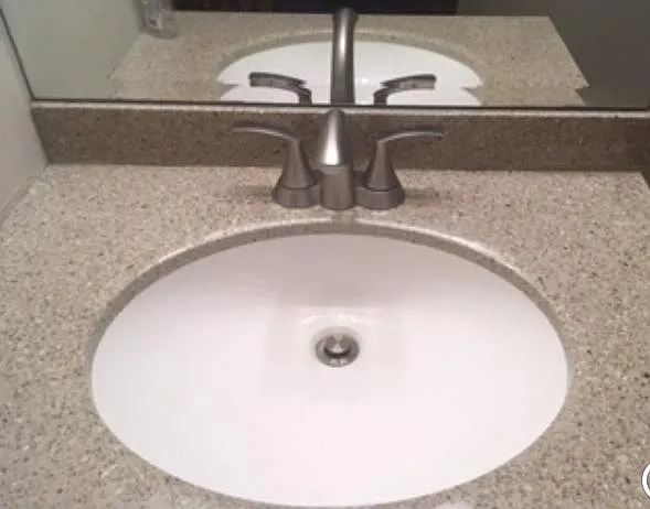 Beautiful new granite effect sink and Moen fixture - upper bathroom
