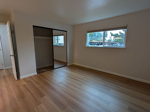 Master bedroom with mirrored closet