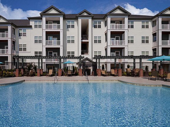 Soak in the sun at our expansive saltwater swimming pool with outdoor TV and cabana