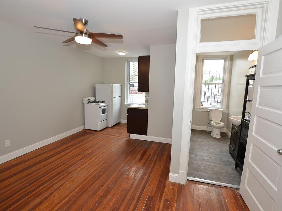View of the living room, kitchen and bathroom