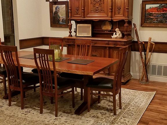 Dining room with antique French buffet which stays with house