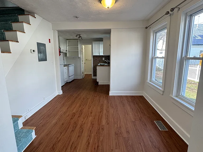 Dining room, with kitchen and bathroom beyond