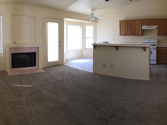 Family room with fireplace attached to kitchen