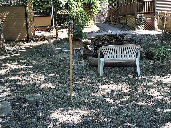 Shady fenced yard with Fire 