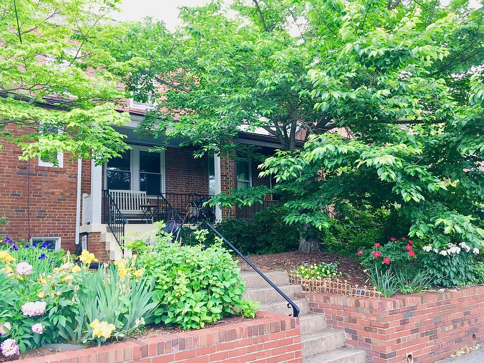 Front of house with elevated porch, room for table and chairs