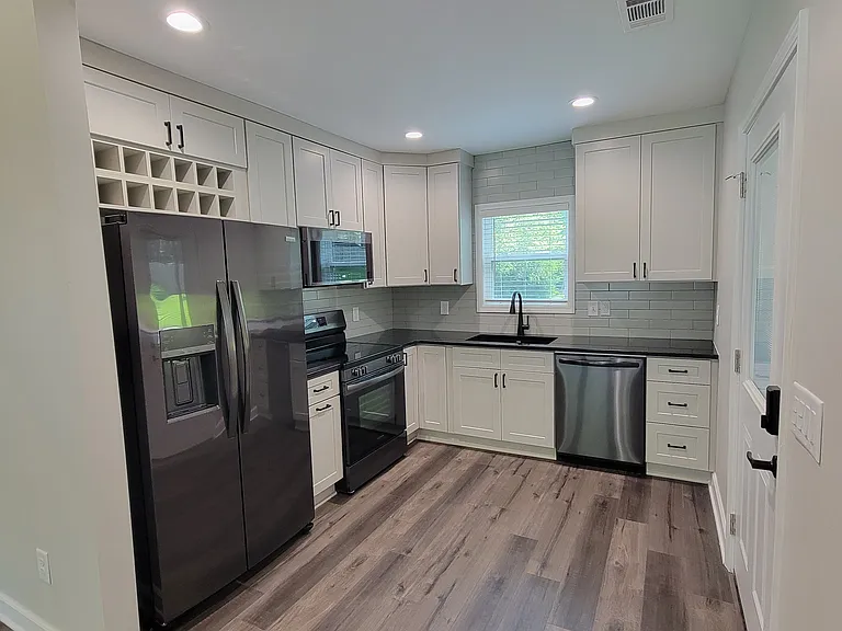 All-electric Frigidaire Gallery Series kitchen set -- complete with refrigerator, freezer with ice and water dispensers, range, microwave, dishwasher, and garbage disposal.