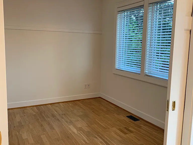 Bedroom with walk-in closet (to right of doors to room)