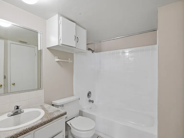 Elevate your lifestyle at Wymore 360 Apartments, where modern interiors meet comfort. This stylish bathroom features a sleek design and ample storage, perfect for your daily routine. Explore your new home today and schedule a tour!