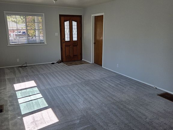 Living room looking at front of house and door