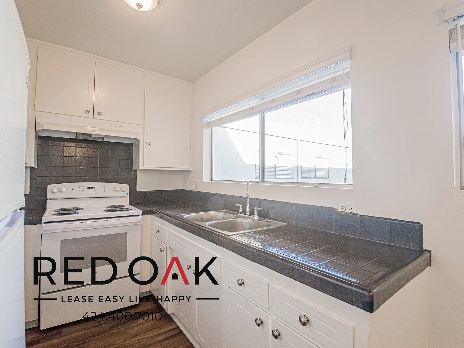 Delightful One Bedroom with Beautiful Floors, On-Site Laundry, and Available Parking ~ In East Ho... — Photo 2