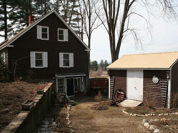 Partially finished walkout basement with outside sink and counter for gardening