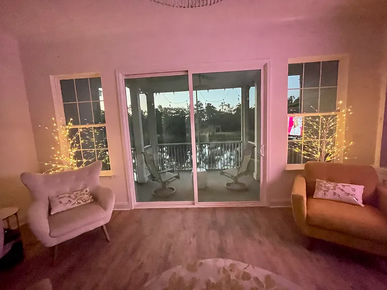 Living room with oversized balcony facing the lake.