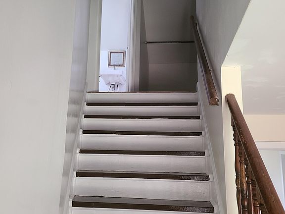 Stairway, view of half bath upstqairs
