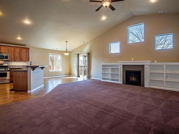 Open living room, dining, and kitchen