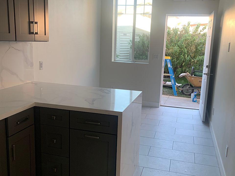 Living Area, AC unit, and Entrance Door
