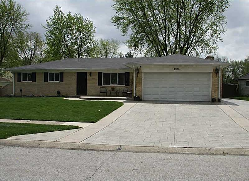 Exterior Front. LOW MAINTENANCE BRICK HOME. STAMPED CONCRETE DRIVE, PORCH AND PATIO.