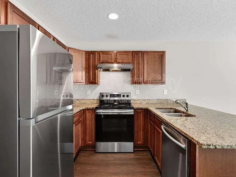 7608 Rain Forest Dr N — Photo 3