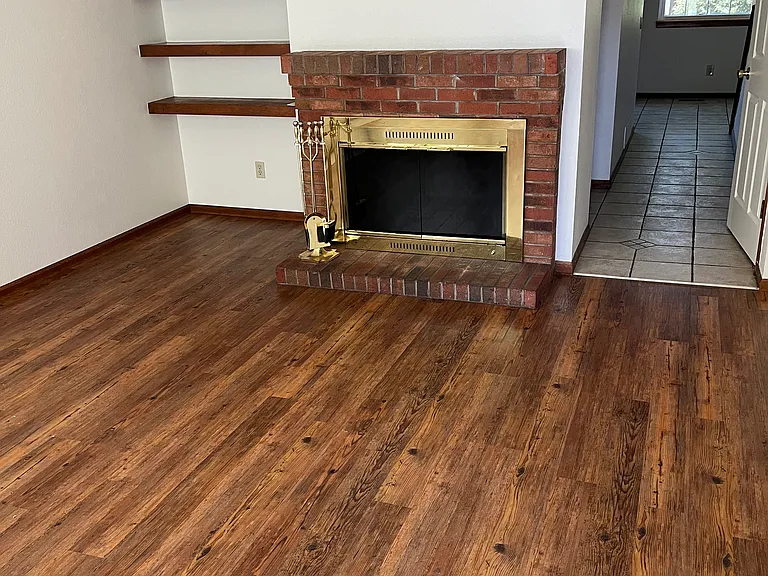 Laminate flooring, built-ins and wood-burning fireplace!