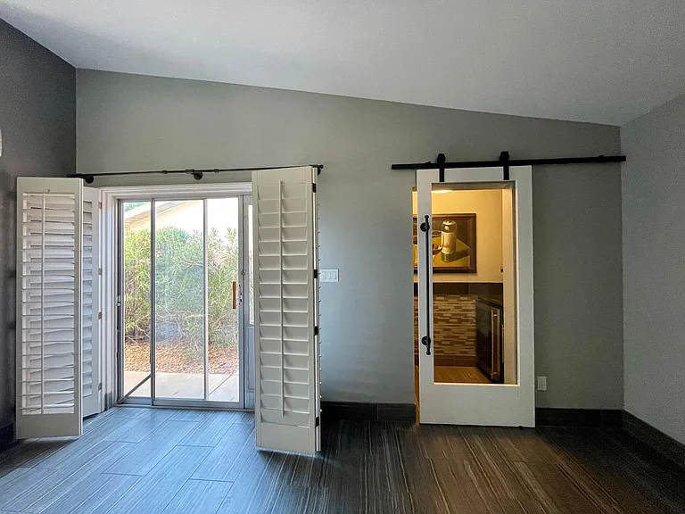 Looking to the Dining Room and Wine Closet. Sliding door with views to the side yard.