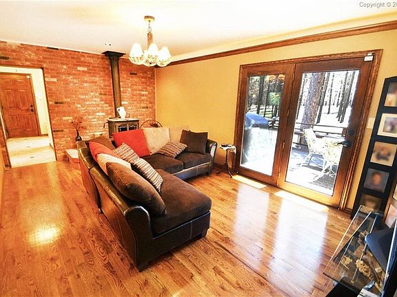 Family room with wood stove and walkout to the back deck.