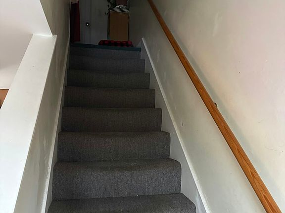 Stairs to bedrooms and master bath