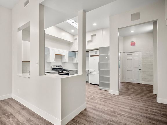 Kitchen and front door entry way from the dining room.