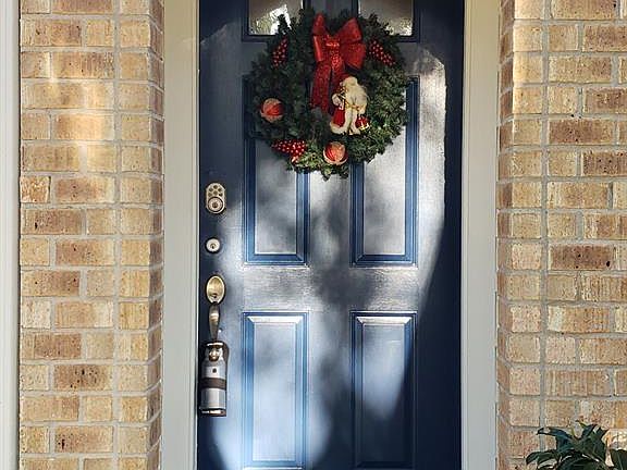 Beautiful blue door and covered front porch, please come in!