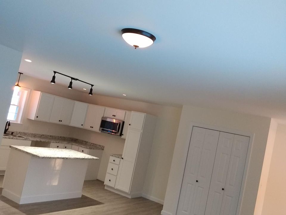 Large room , large entreway closet, mudroom space to the right of photo with room for jackets, boots out of sight of main living area.