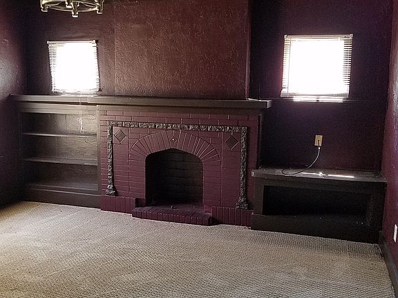 Mock Fireplace with Built-In Shelving