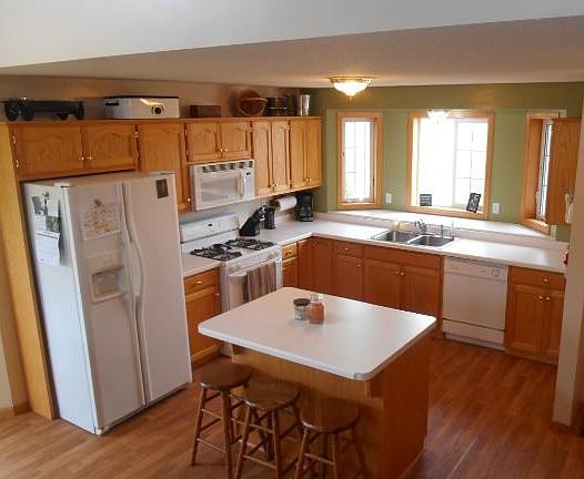 Kitchen view notice the bay window over the sink and the center island