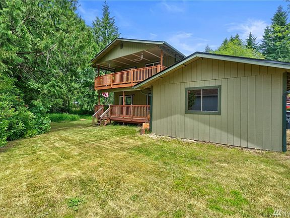 This house has THREE (Yes, Three!) Covered porches - one in front and two out back!