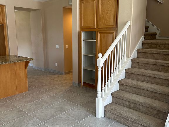 upstairs leading to loft and bedroom #4. additional bathroom upstairs.