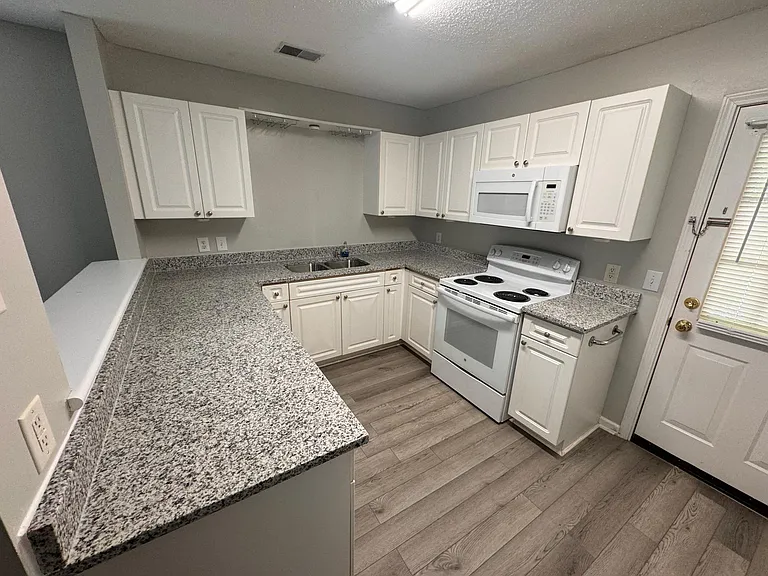 Nice size kitchen with Microwave over the Range with New Upgraded Countertops w/ undermount sink