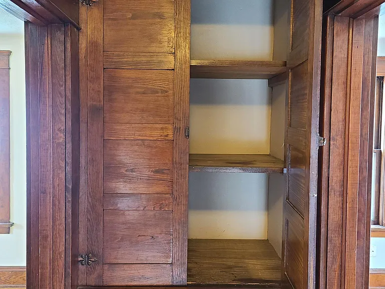 Built In linen closet in hallway of 2nd floor