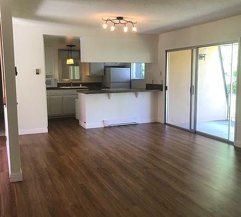 Living room looking into dining and kitchen area