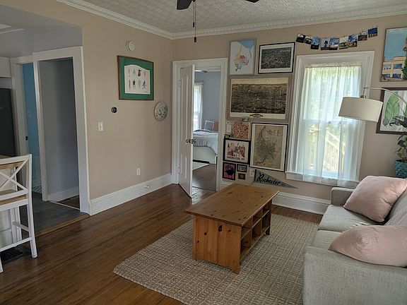 From the front door, facing the back bedroom and backyard. Kitchen to the left