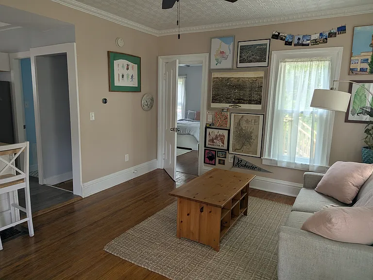 From the front door, facing the back bedroom and backyard. Kitchen to the left
