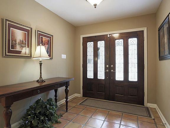 Double doors at front entry ushers you in to Home Sweet Home.